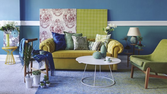 yellow sofa in colourful room