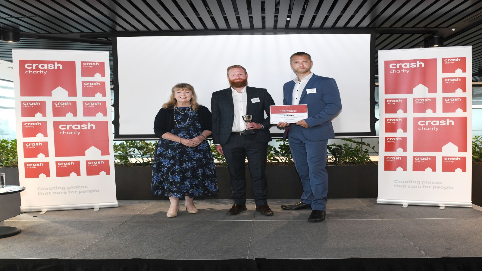 Kevin Higby and Steve Page accept CRASH award on behalf of Geberit