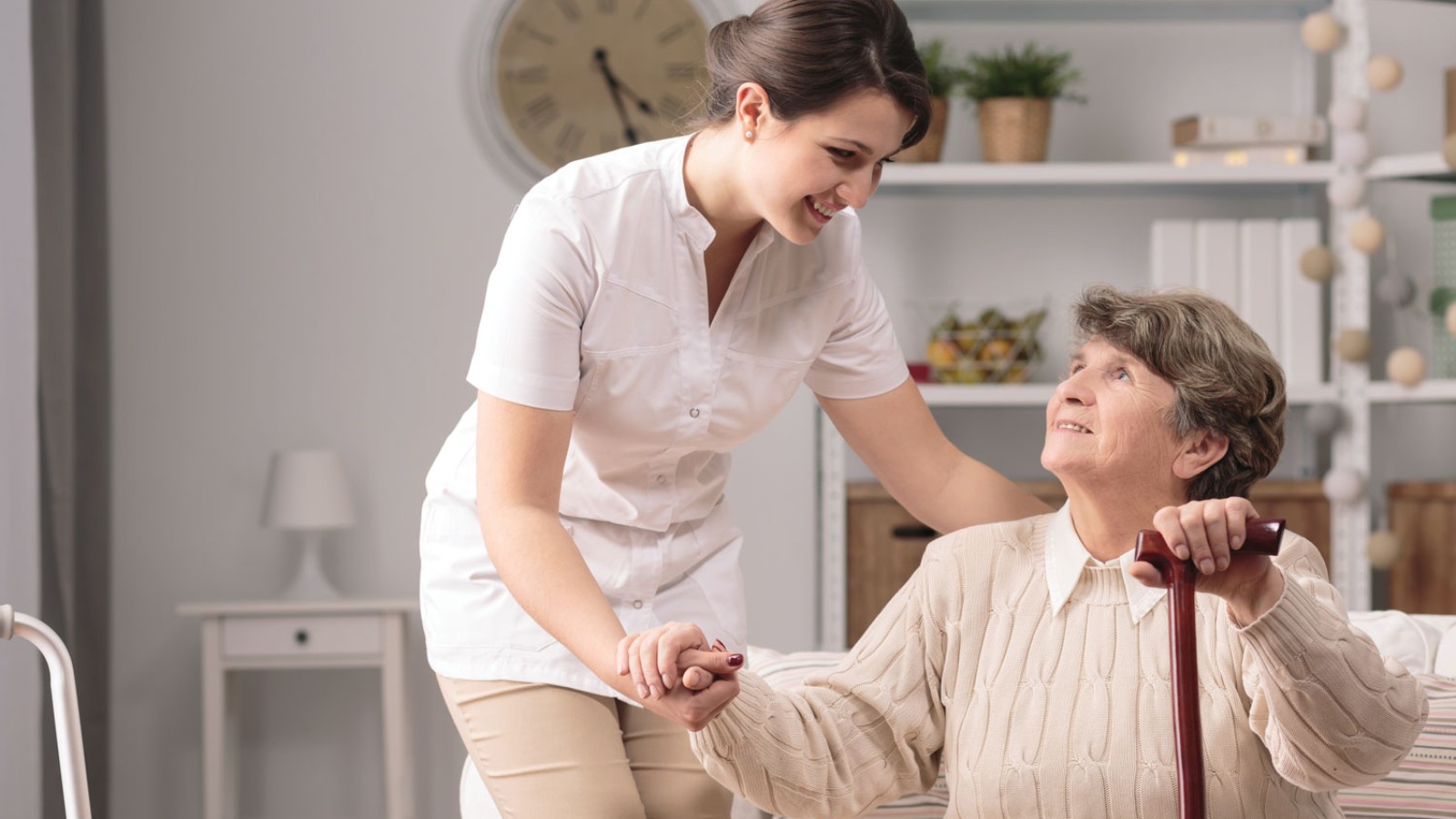 Elderly woman with her caregiver