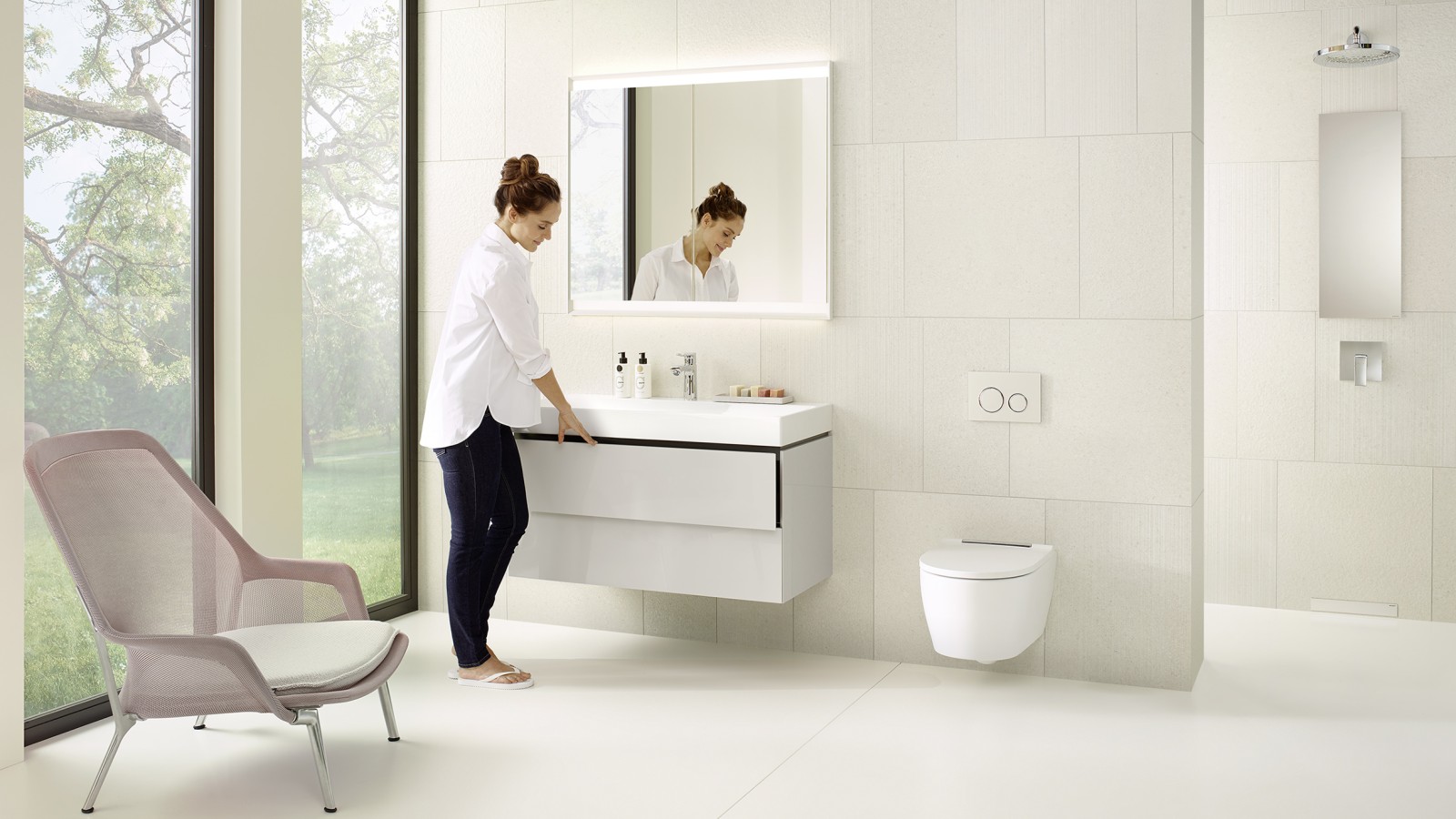 Woman in a white bathroom from the Geberit ONE series