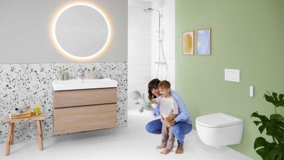 Geberit AquaClean Alba with woman and child in the bathroom