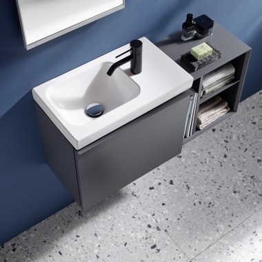 Small Geberit iCon washbasin with side-mounted tap in matt black