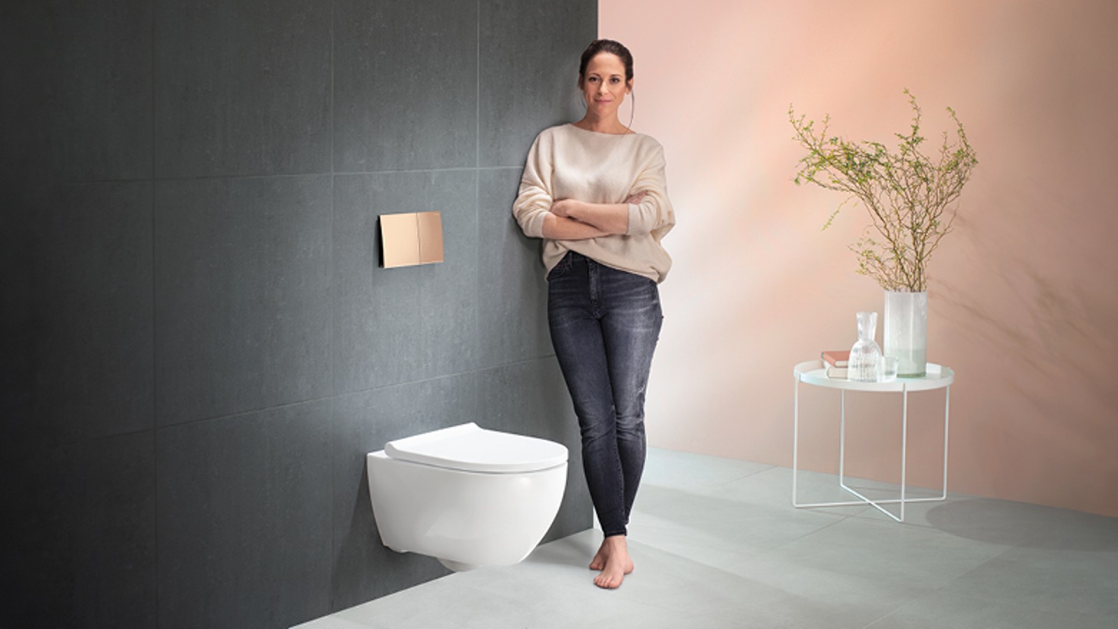 Woman next to the Geberit toilet system