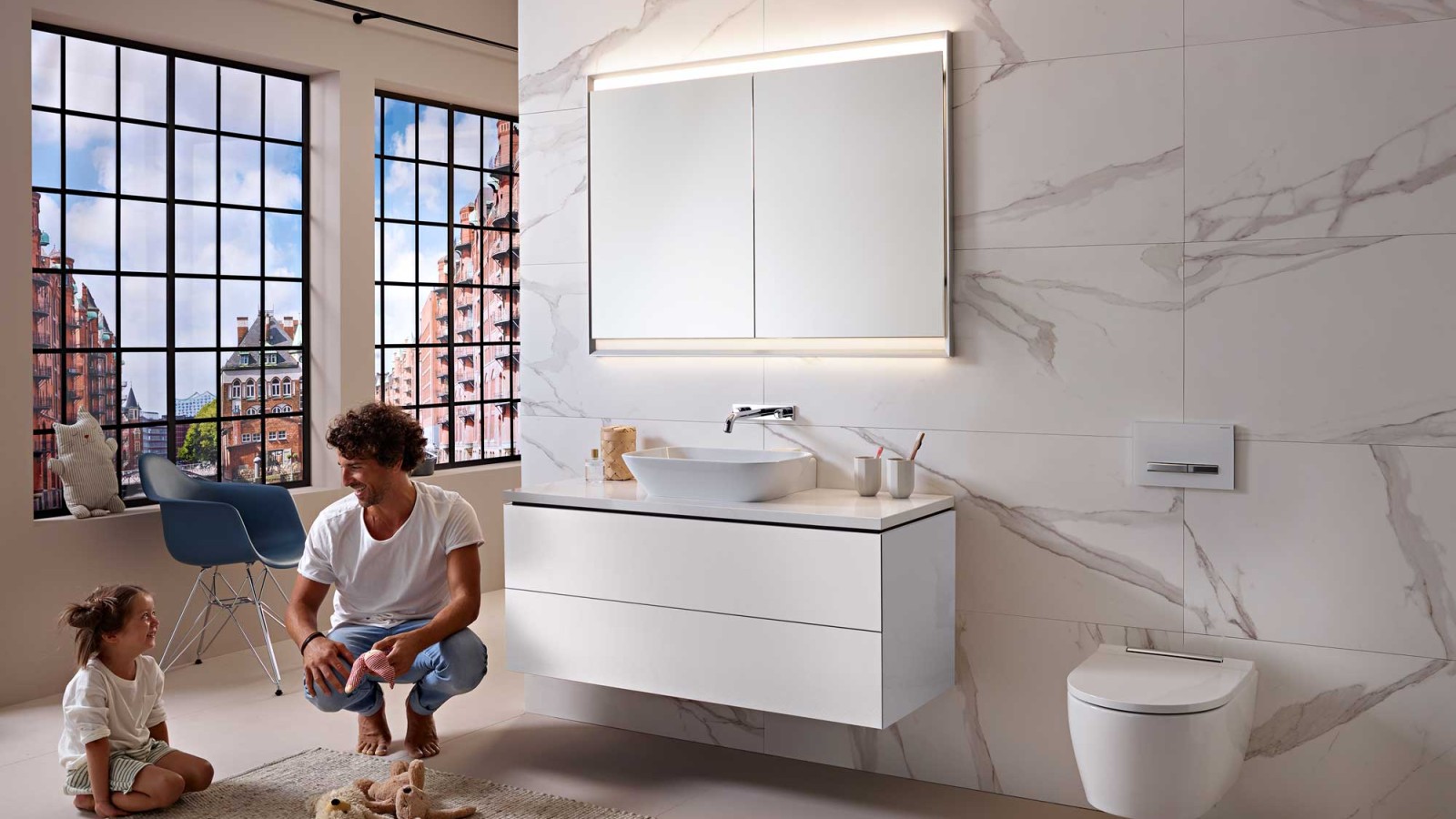 Man and child in a white bathroom from the Geberit ONE series