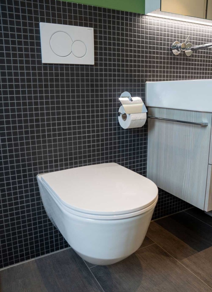 Bathroom with white Geberit flush plate