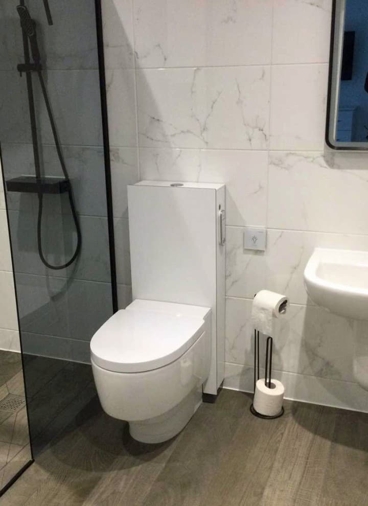 Geberit AquaClean Mera Care wash and dry toilet installed in a private bathroom Geberit AquaClean Mera Care wash and dry toilet installed in a private bathroom