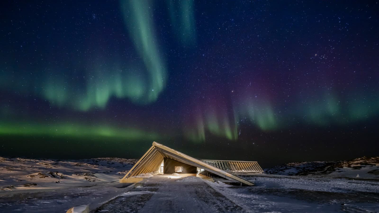 The Icefjord Centre in the spectacular northern lights of the Greenlandic polar night (© Adam Mørk) The Icefjord Centre in the spectacular northern lights of the Greenlandic polar night (© Adam Mørk)