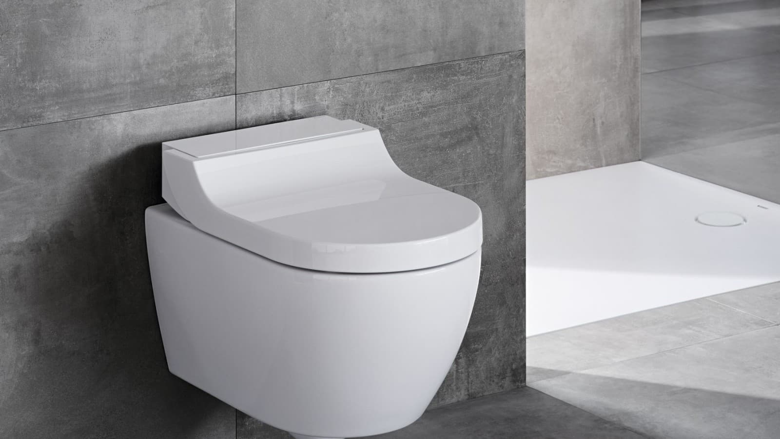 Geberit AquaClean Tuma Classic shower toilet in a grey bathroom Geberit AquaClean Tuma Classic shower toilet in a grey bathroom